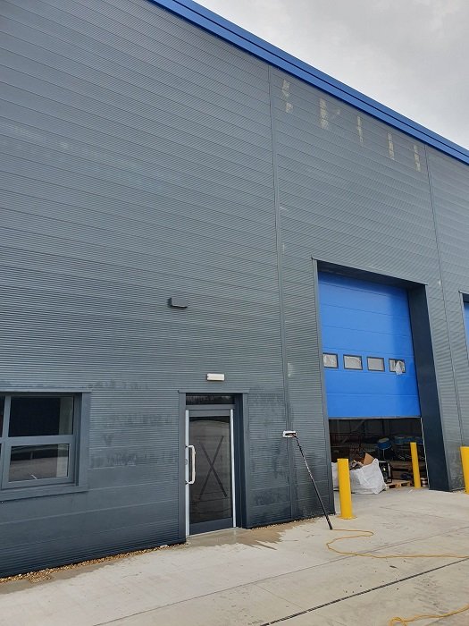 Industrial warehouse exterior facade cleaning
