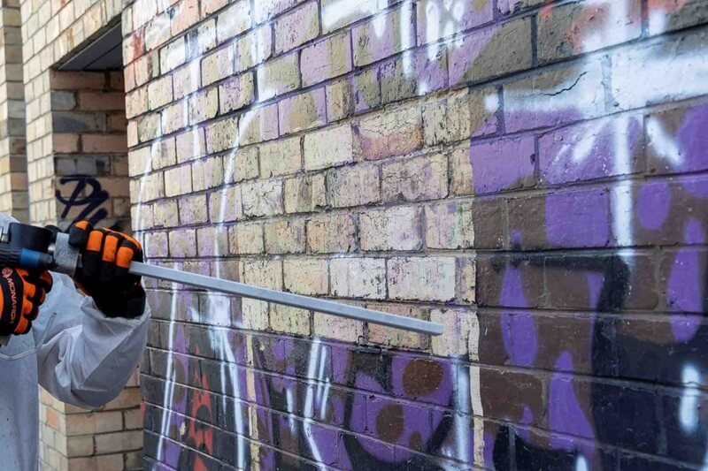 Removal of graffiti from a public brick wall