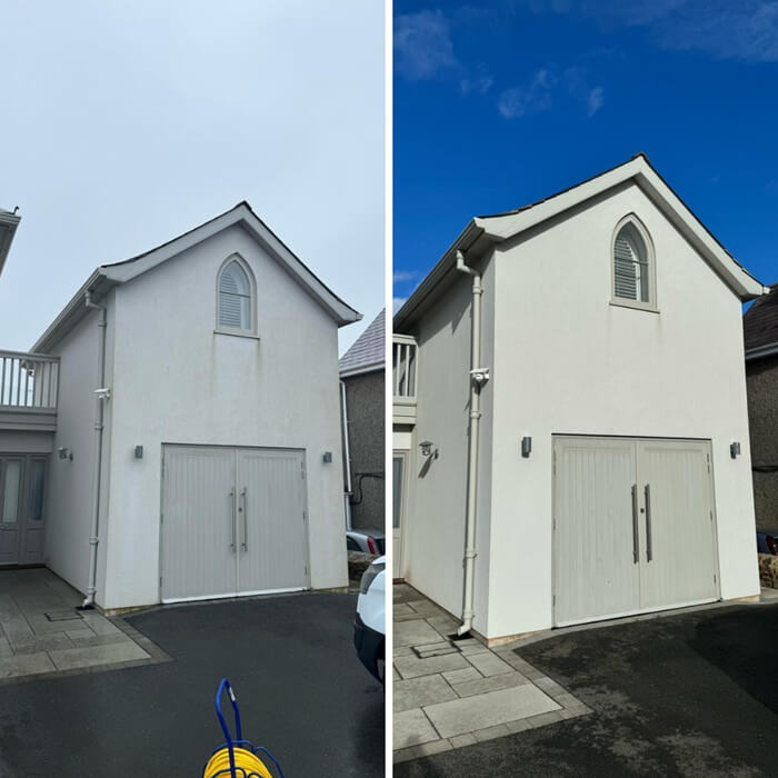 Exterior wall of a residential garage building after professional cladding cleaning