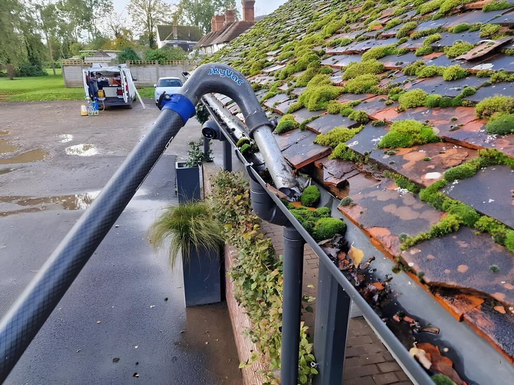 Gutter cleaning in Bristol using vacuum system to remove debris