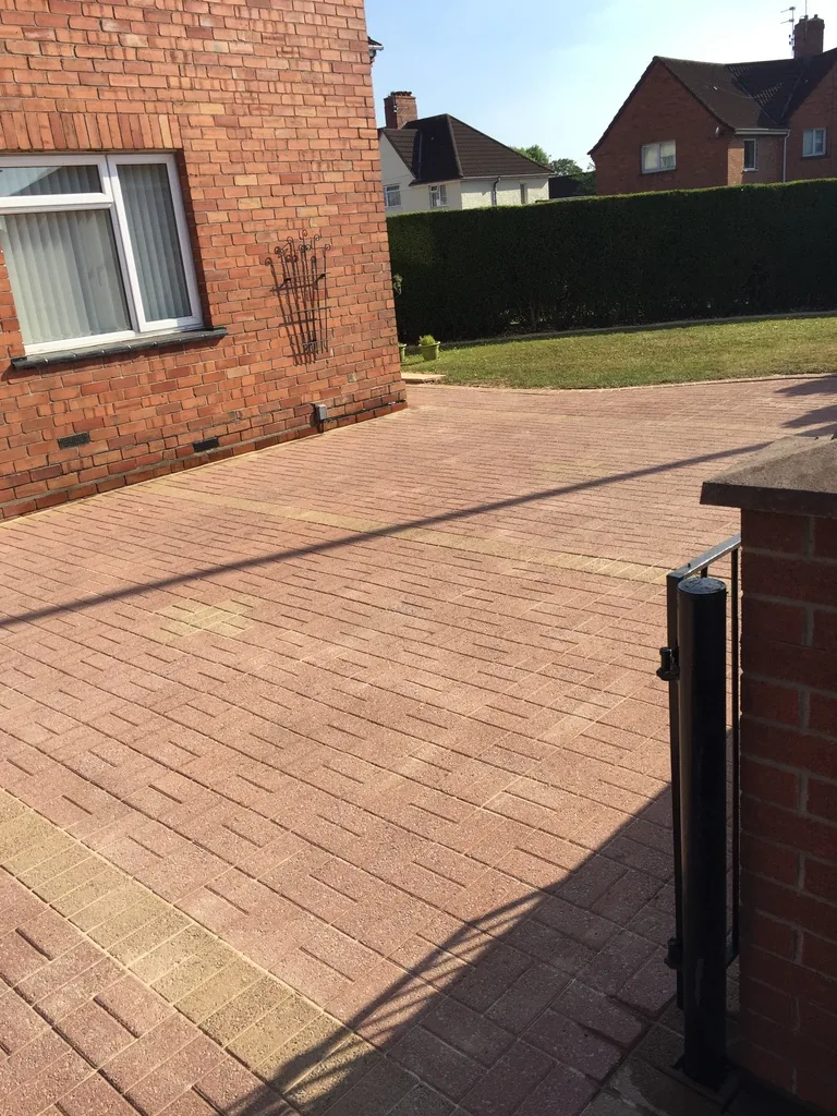Restored block paving driveway after professional jet washing and re-sanding service by GB Cleaning in Knowle, Bristol