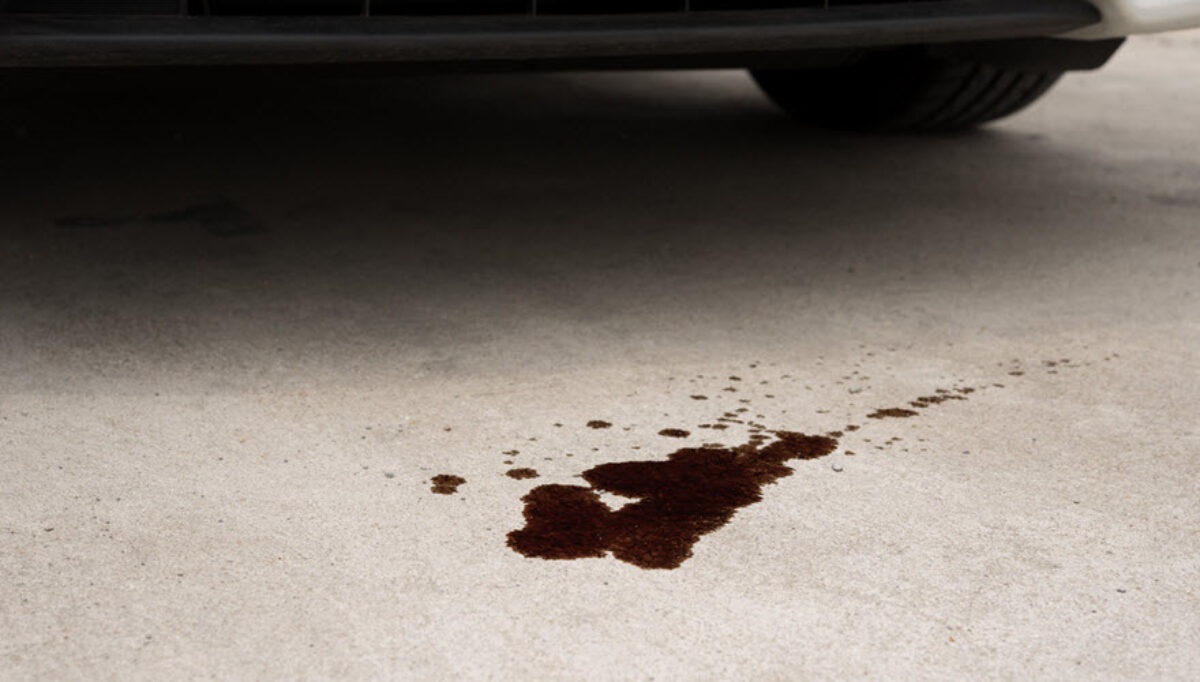Motor oil stain on a driveway surface